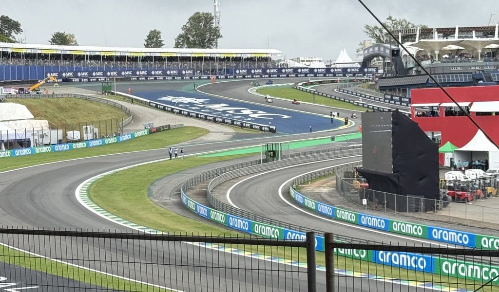 Formula 1 sponsorship Aramco barriers and MSC Cruises branding around the Senna S at Interlagos, seen from Grandstand N.