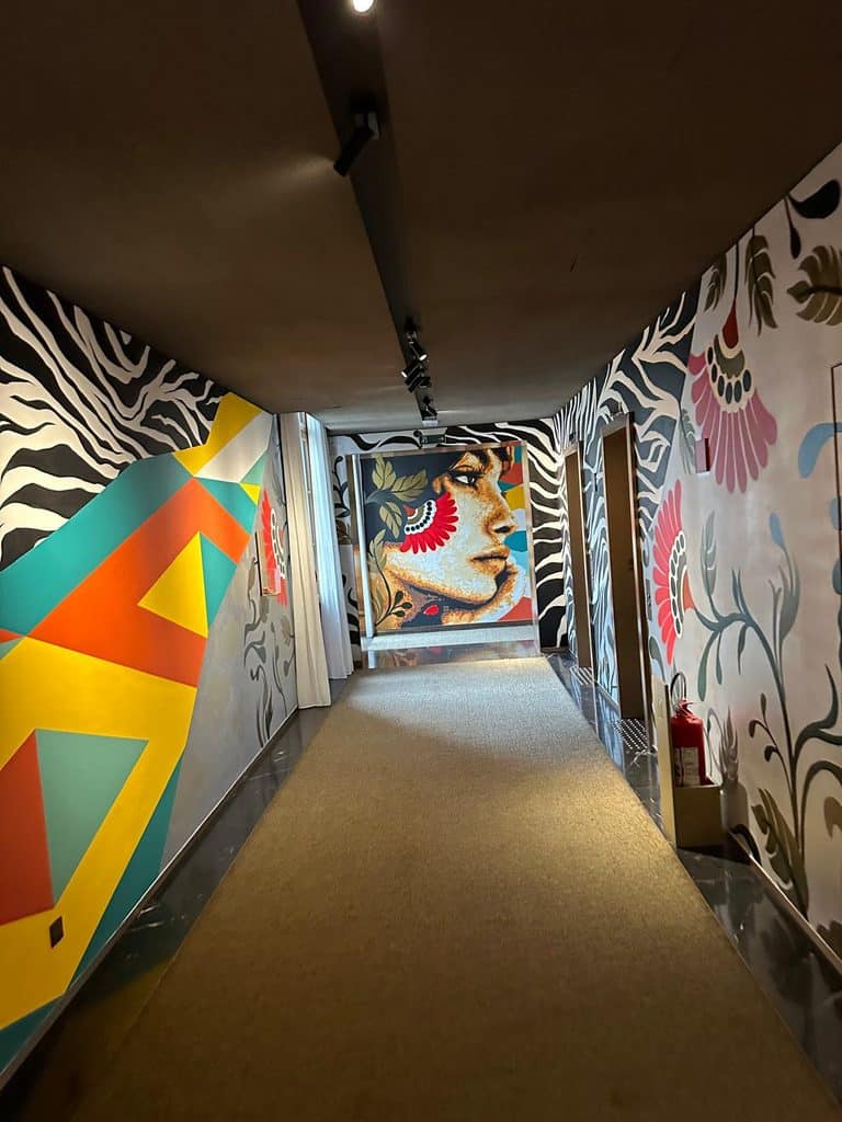 São Paulo Luxury Travel Colorful murals lining a corridor at Rosewood São Paulo