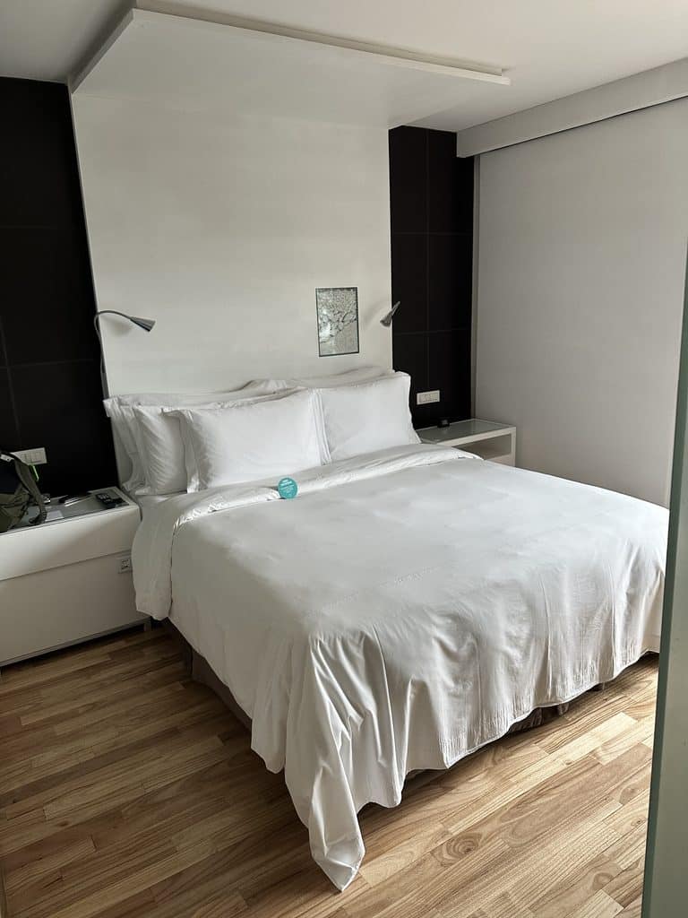 São Paulo Luxury Travel São Paulo luxury travel: a guest room at Hotel Unique with a white bed and wooden floor