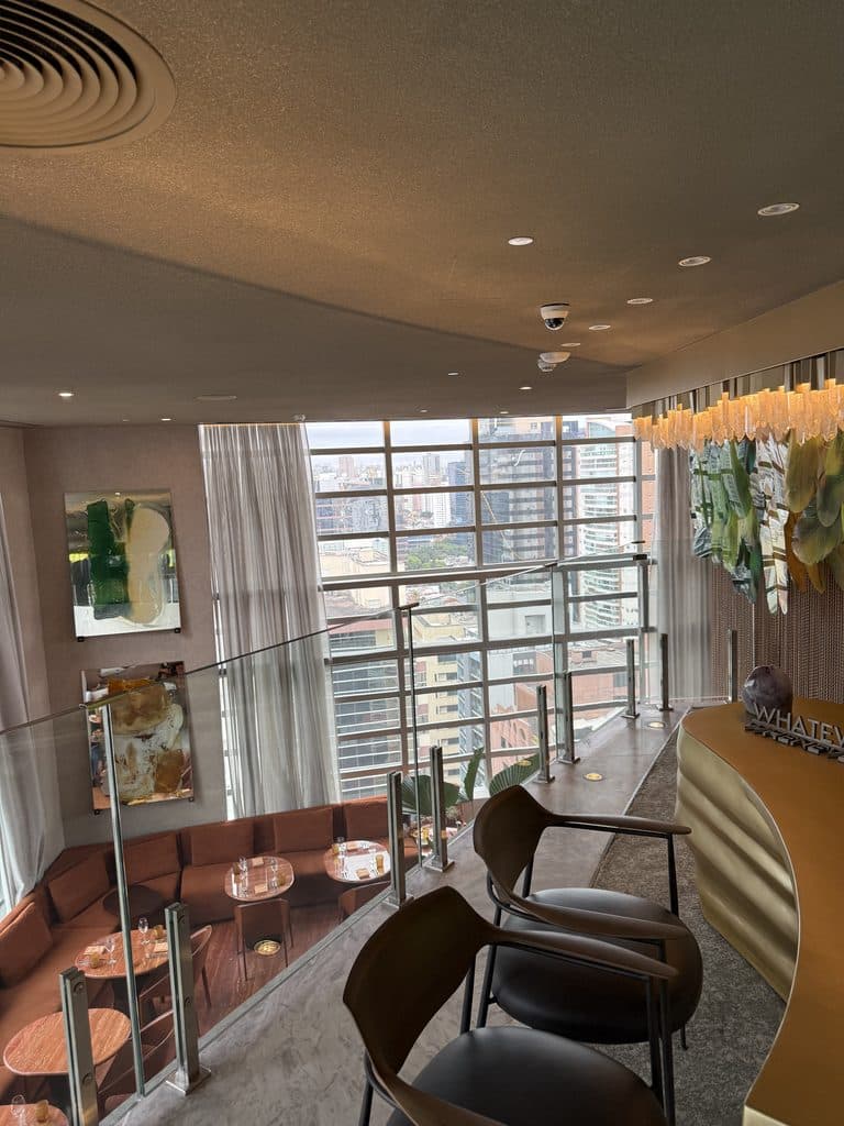 São Paulo Luxury Travel W São Paulo interior with tall windows, lounge seating and a city view