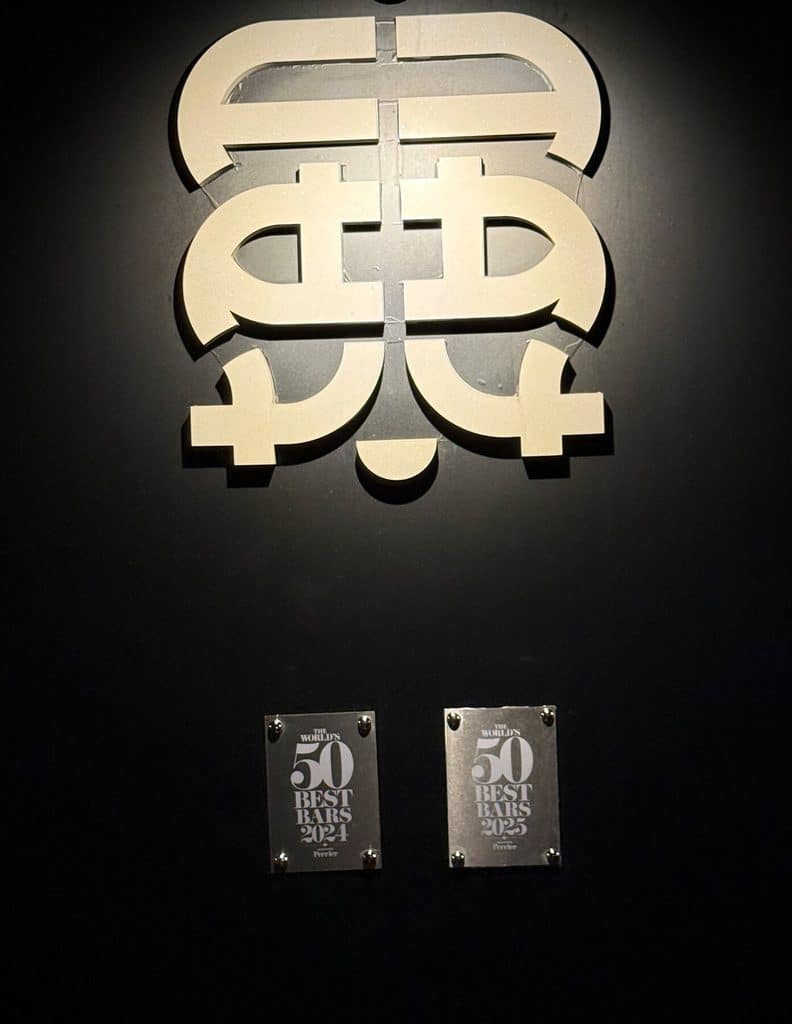 Tan Tan’s wall emblem above World’s 50 Best Bars plaques dated 2024 and 2025.