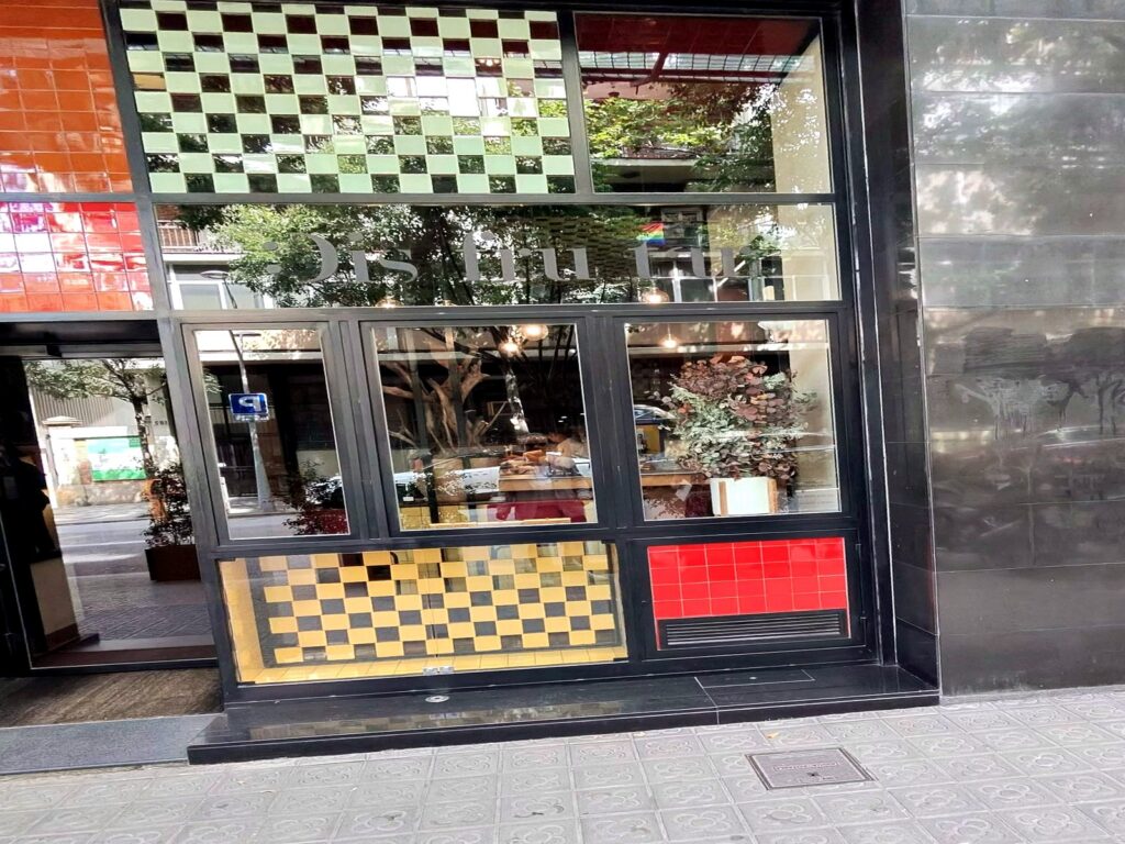 Exclusive Restaurants The colorful tiled entrance to Disfrutar in Barcelona, one of the exclusive restaurants in this guide.