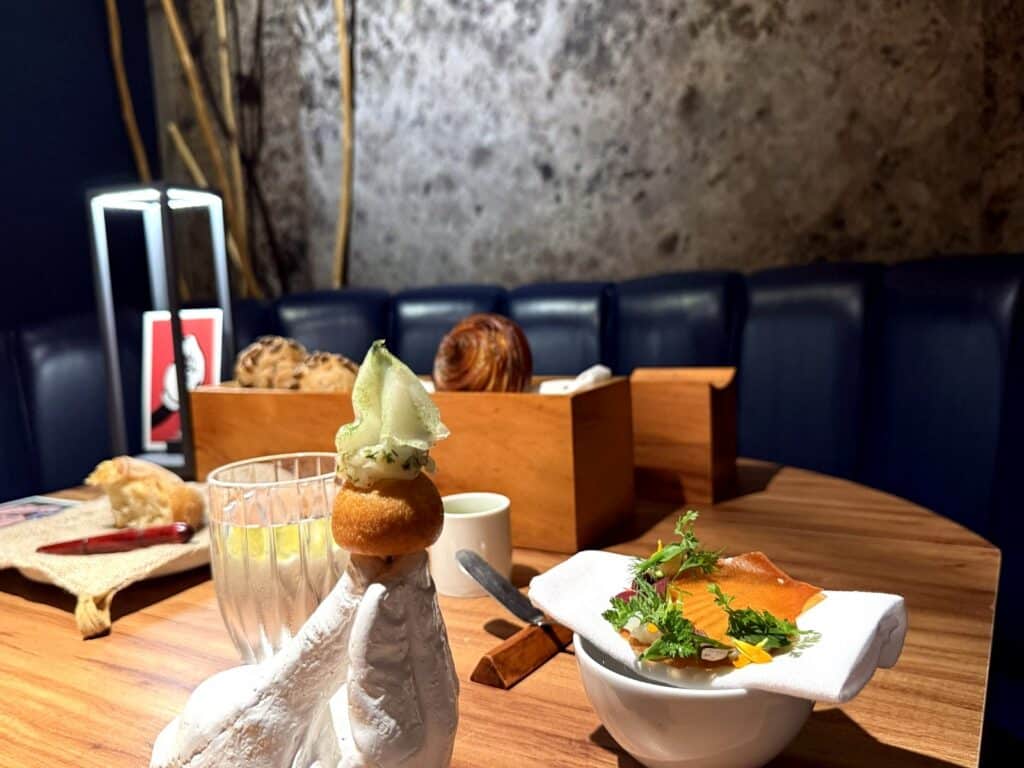 Exclusive Restaurants Chef Luiz Filipe Souza’s signature Bomba de Vieira, or Scallop Bomb, served directly onto the diner’s hand at three-Michelin-starred Evvai in São Paulo.