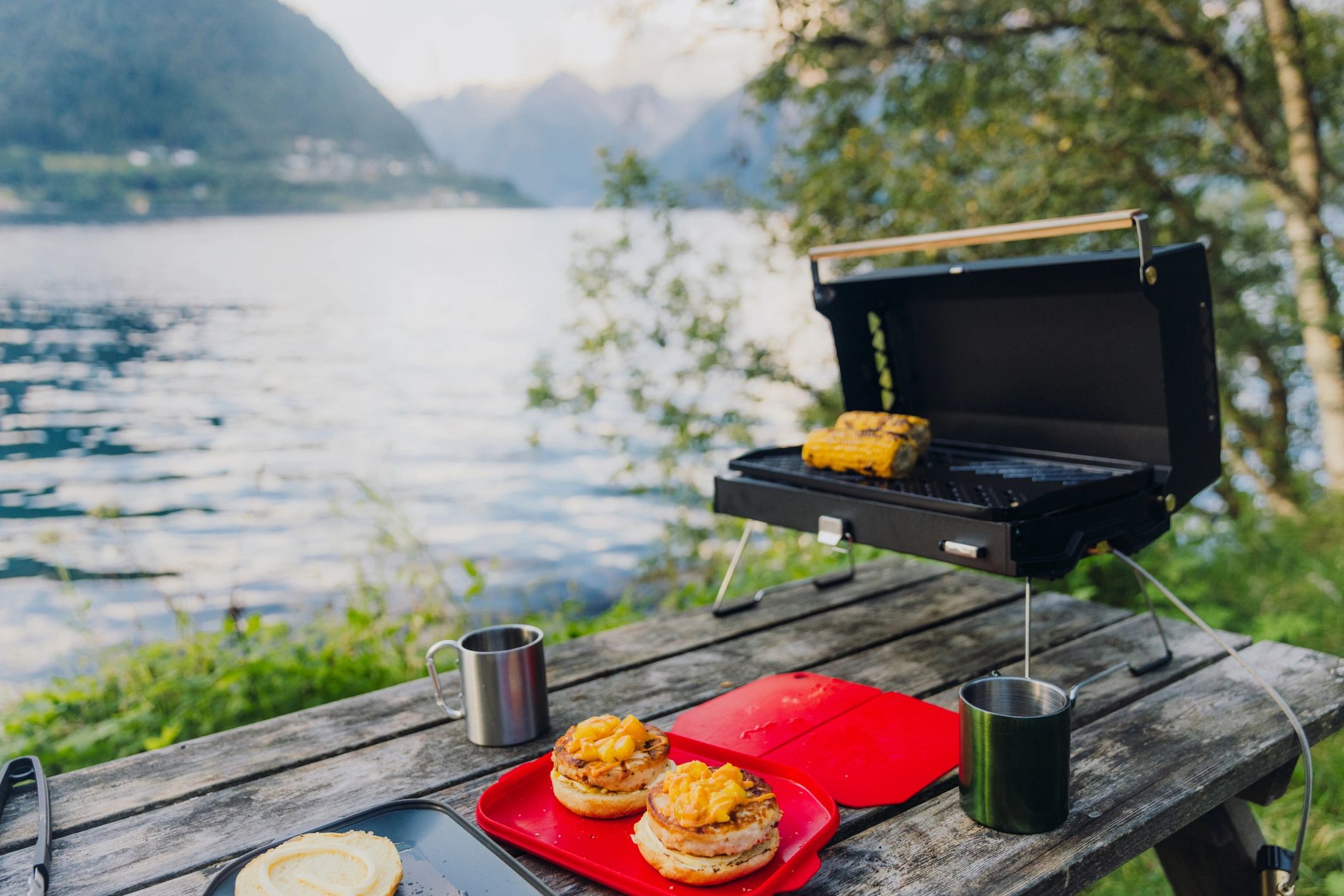 Outdoor food and travel scene by the water at sunset