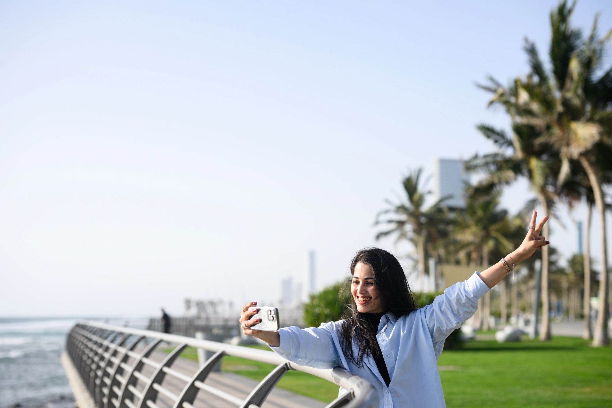 Traveler capturing a seaside moment