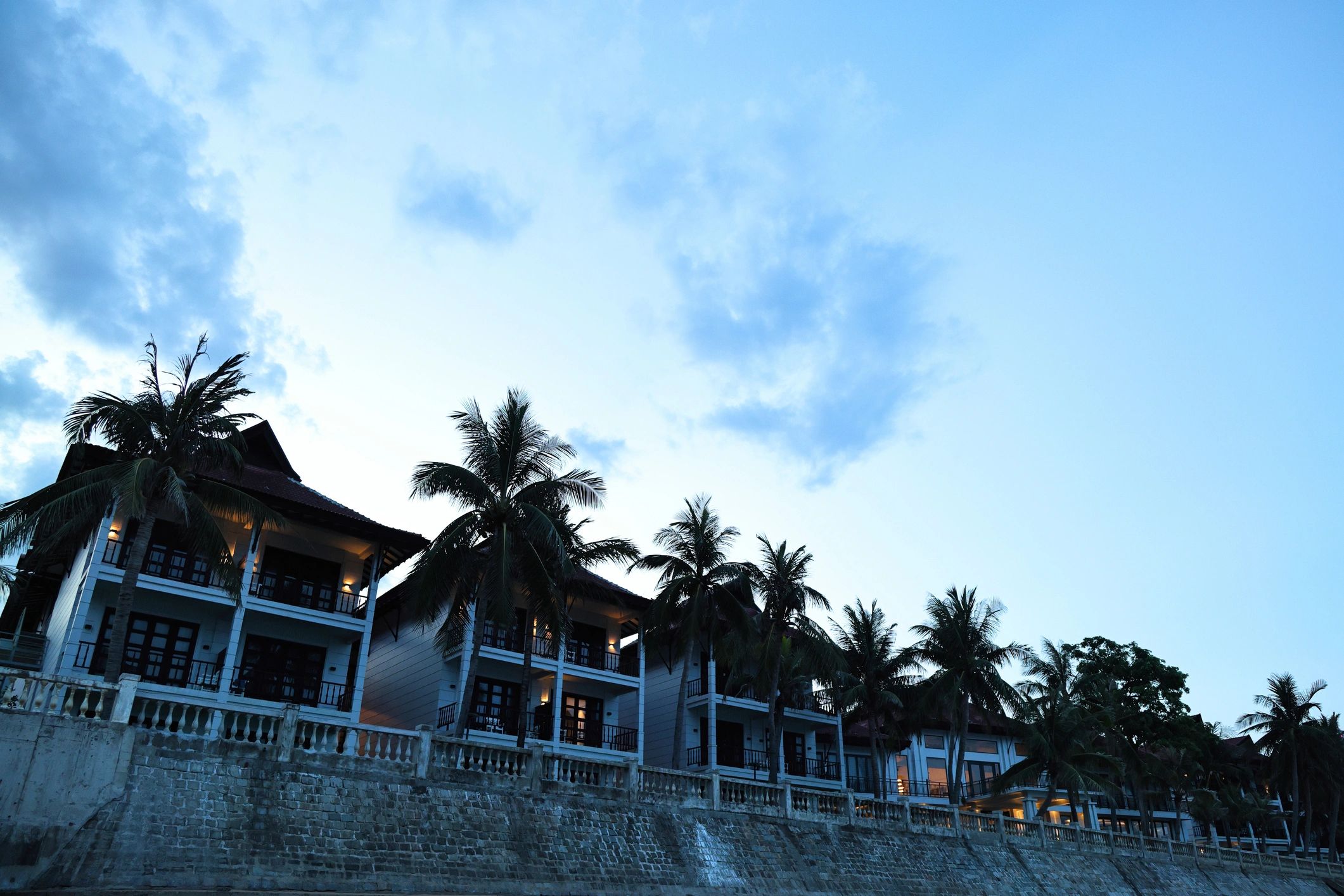 Luxury coastal resort villas at dusk