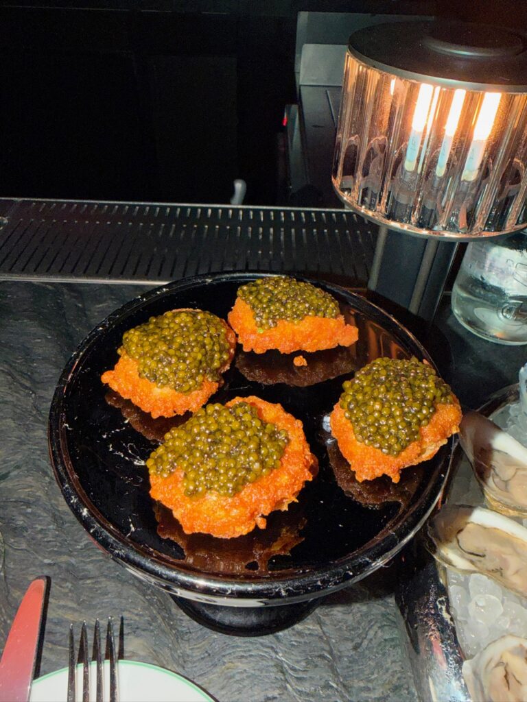 Bar Chimera's Golden Nuggets topped with premium caviar at the Whiskey Bar inside 550 Madison in New York City.