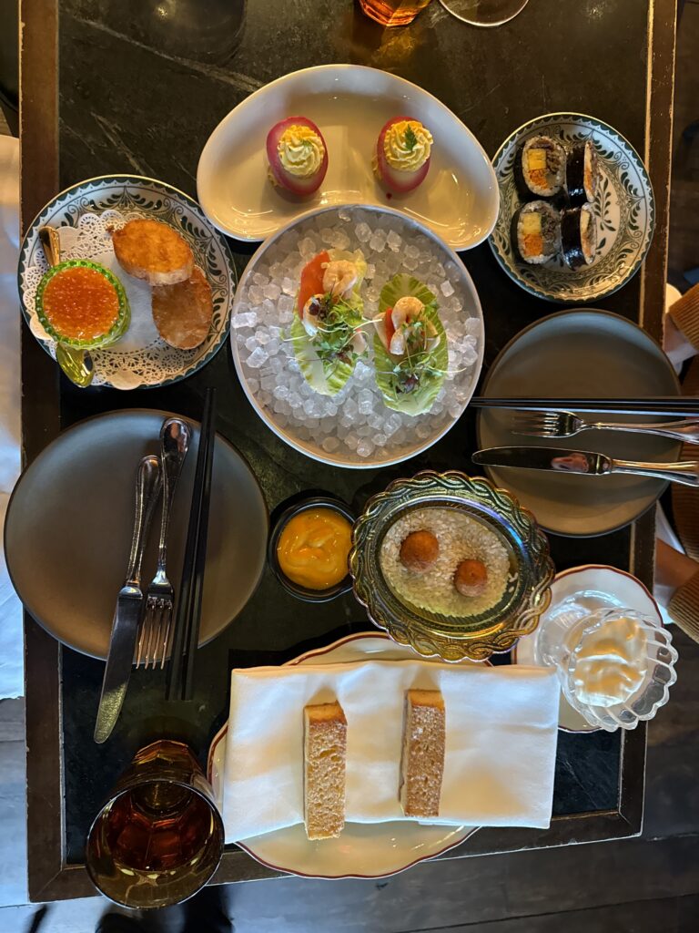 COQODAQ's Brucket List Appetizers featuring Golden Nuggets with caviar, seafood, sushi rolls, and signature small plates in New York City.