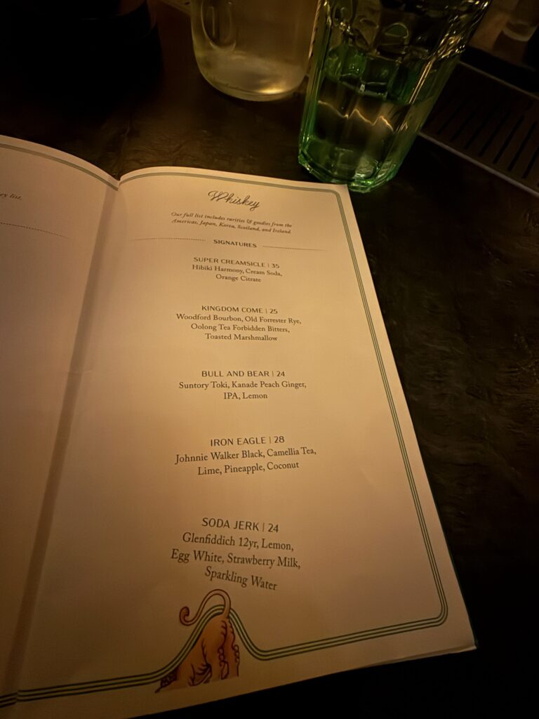 The Whiskey Bar signature cocktail menu at Bar Chimera inside 550 Madison in New York City, featuring house whiskey cocktails.