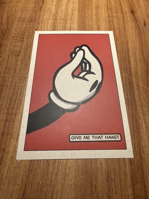Pop-art “Give Me That Hand” tasting-menu card presented at Evvai São Paulo