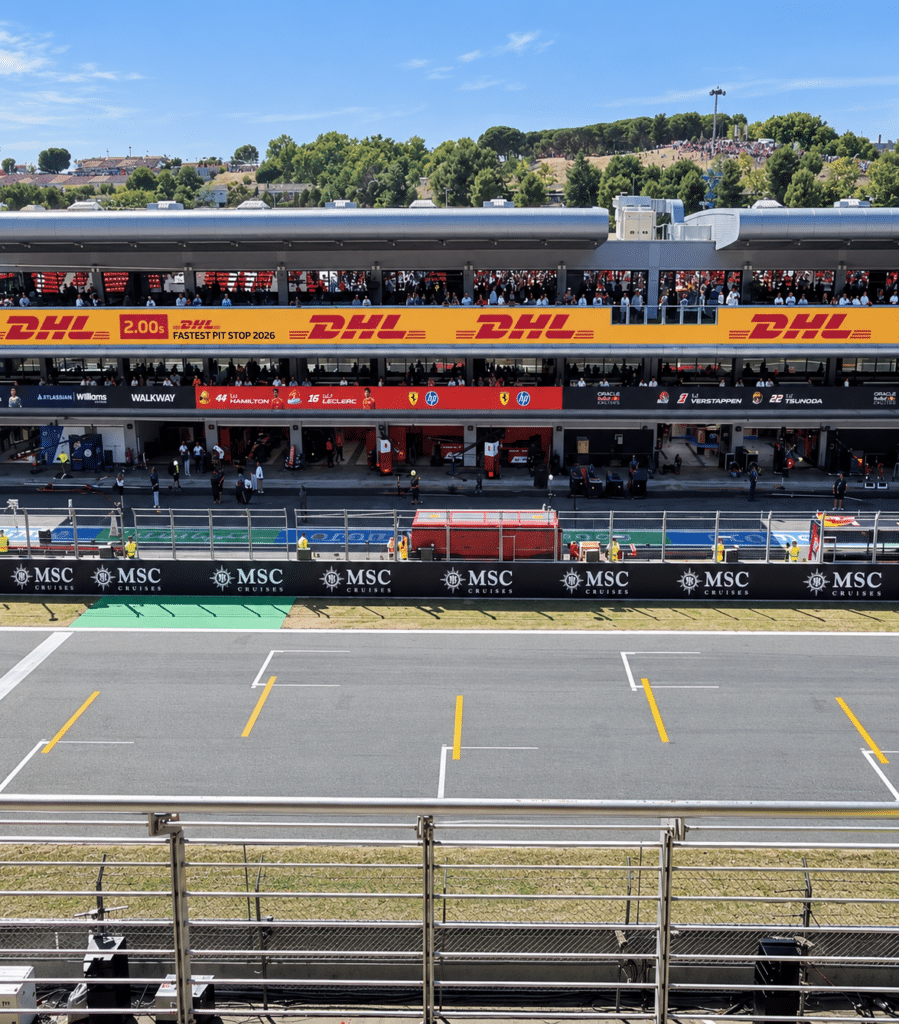 Formula 1 View from the grandstand across the track toward team garages and hospitality terraces in Barcelona.
