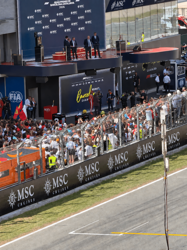 Food-Focused Trips Fans gathered beside the track beneath the podium at the 2026 Barcelona Grand Prix.
