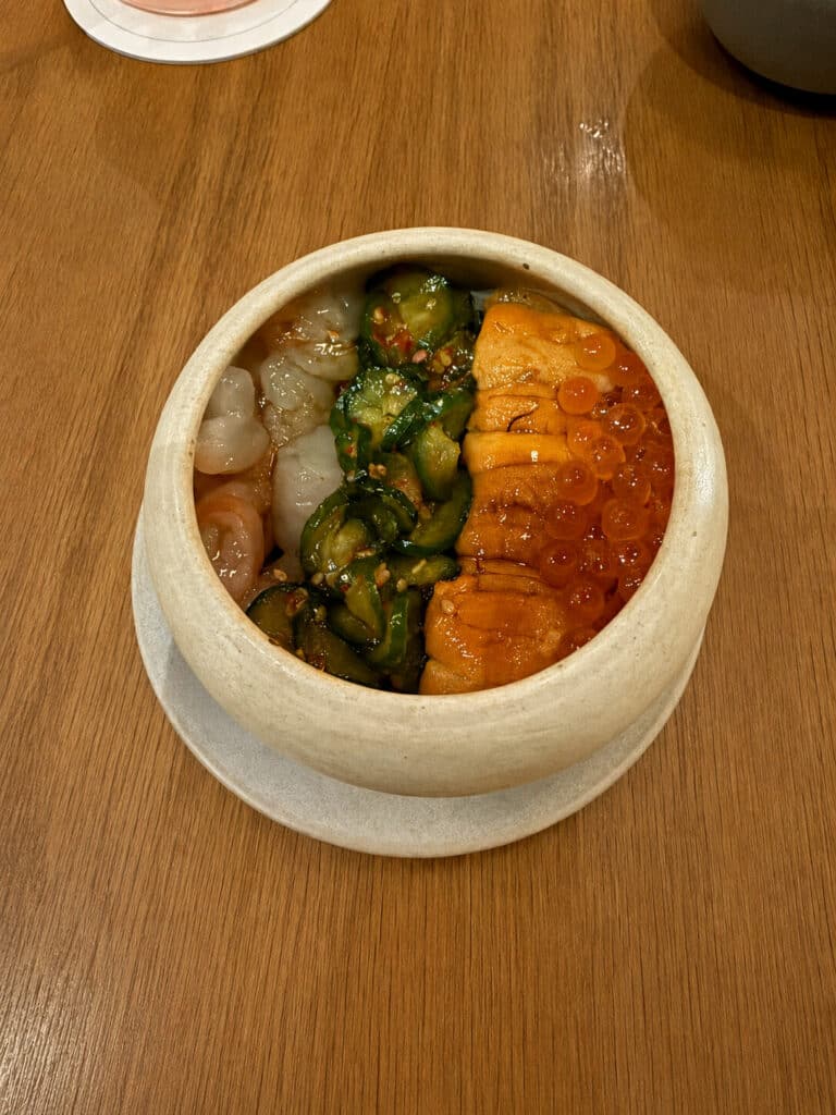 Oiji Bowl with sea urchin, spotted prawn, ikura, cucumber, and seaweed rice at Oiji Mi in New York City