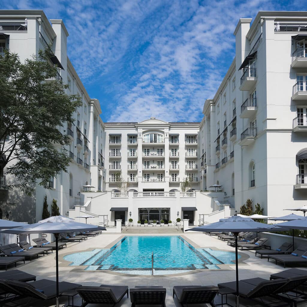Swimming pool and white exterior of Palácio Tangará luxury hotel in São Paulo, Brazil