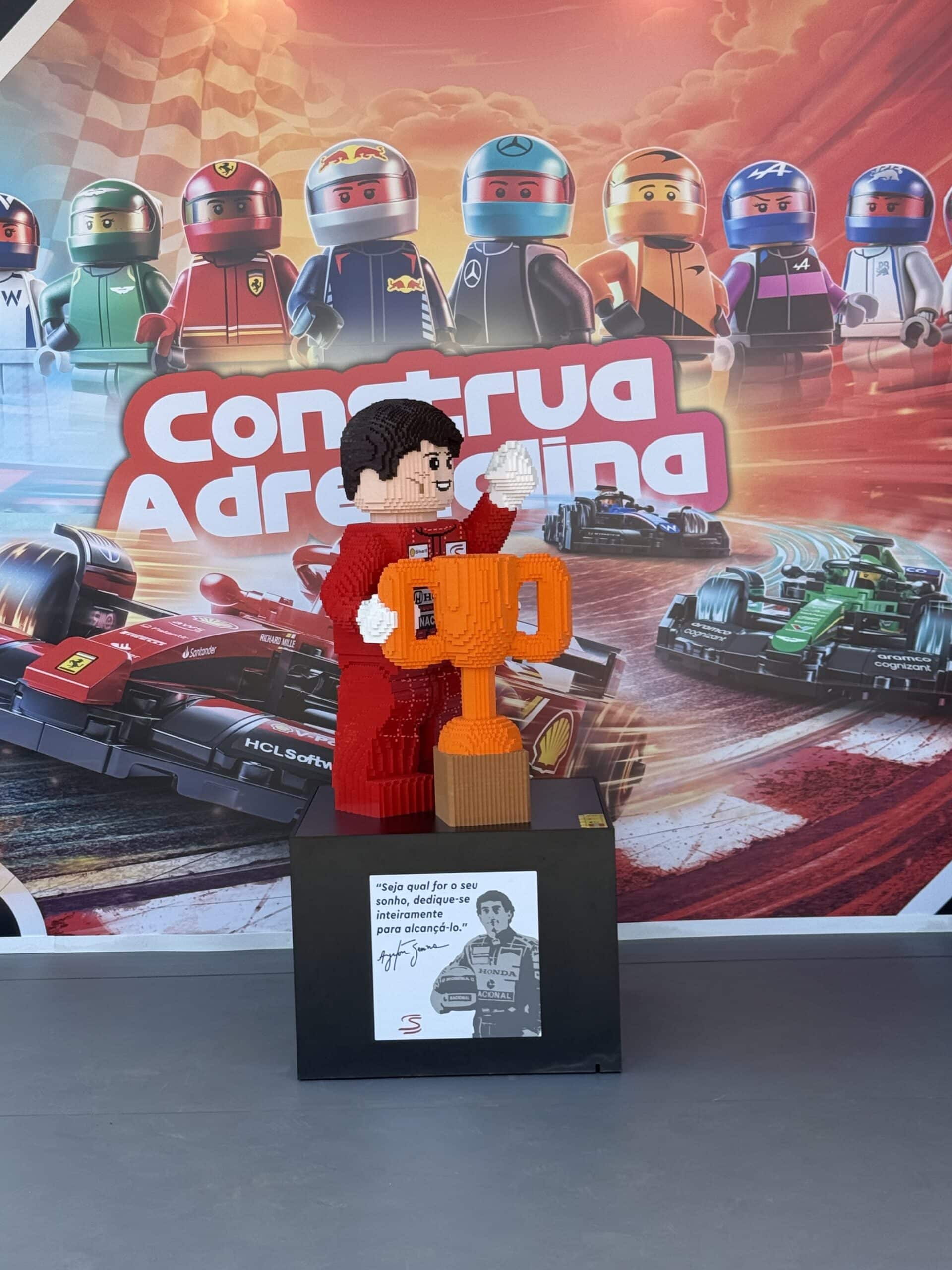 Life-size brick sculpture of Ayrton Senna in a red racing suit