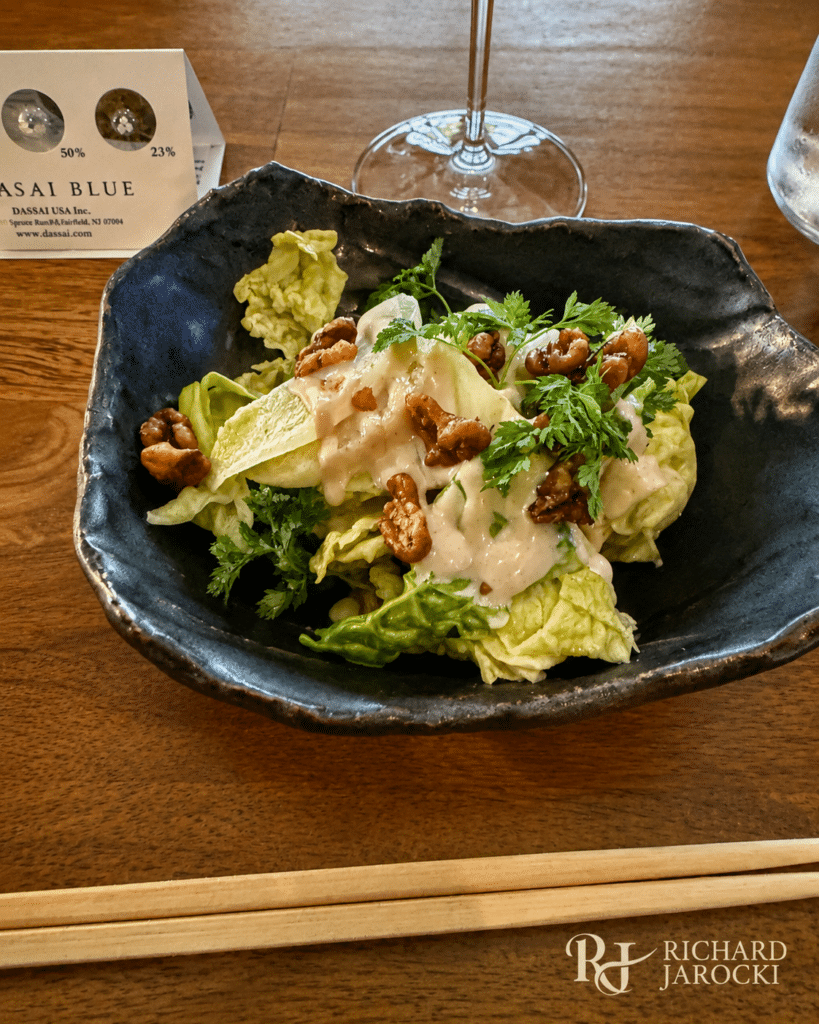 Chilled summer cabbage with tofu sauce, candied walnuts and chervil.
