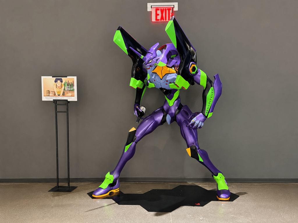 Purple-and-green Evangelion Unit-01 figure displayed inside Dassai Blue Sake Brewery