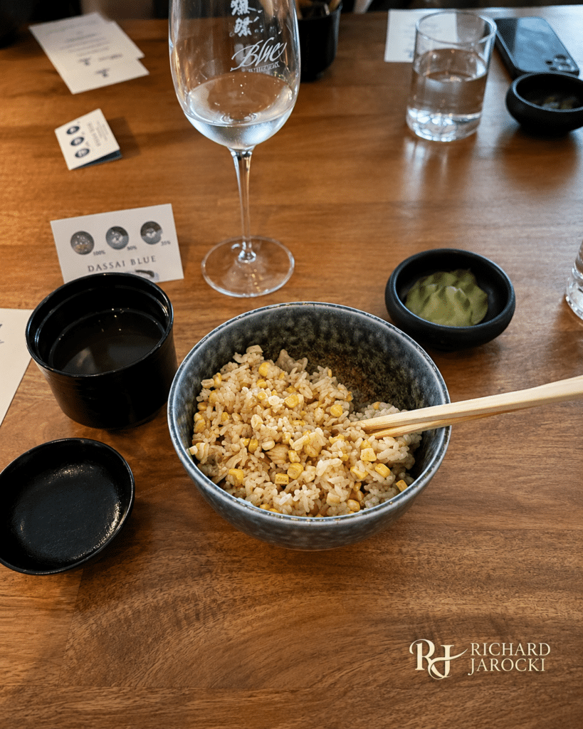 FOUR CORNERS DASSAI BLUE POP-UP Local rice with sweet corn, clams, fish-bone broth and pickled cucumbers.
