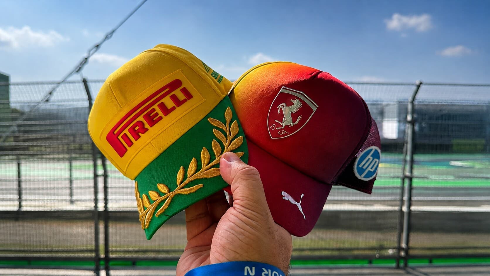 Pirelli and Ferrari caps held trackside at Interlagos in São Paulo