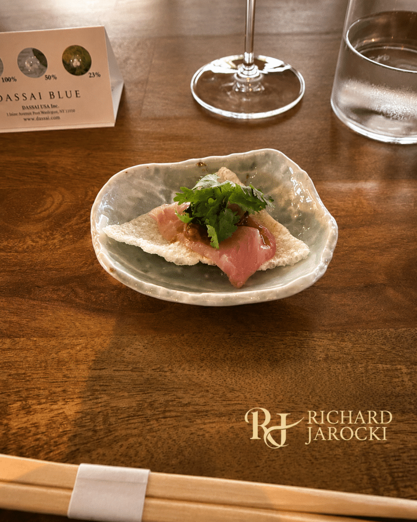 Four Corners Dassai Blue Pop up Hamachi with cilantro and sauce served over crispy rice at the Four Corners pop-up.