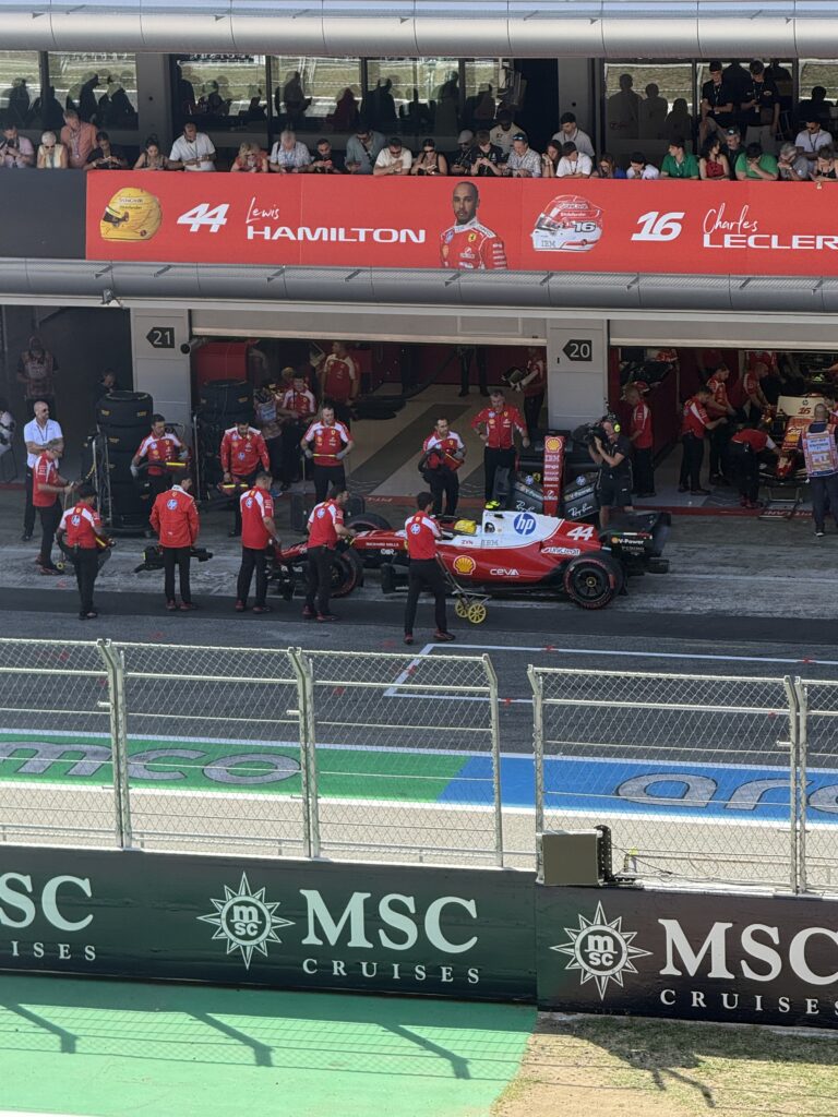 Ferrari mechanics surrounding Lewis Hamilton’s number 44 Formula 1 car outside the garage at the 2025 Barcelona Grand Prix