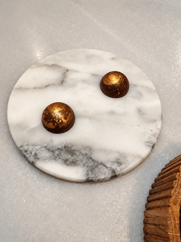 Chocolate petits fours with gold detailing at Mont Bar Barcelona