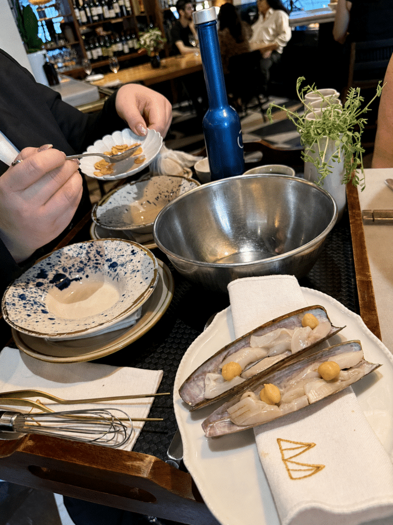 Razor clams with ponzu prepared tableside at Mont Bar Barcelona