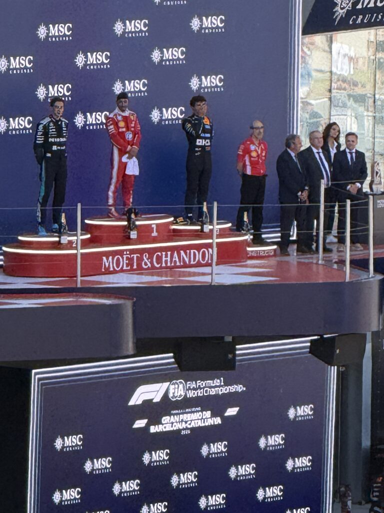 Drivers standing on the podium during a ceremony at the 2025 Barcelona Grand Prix