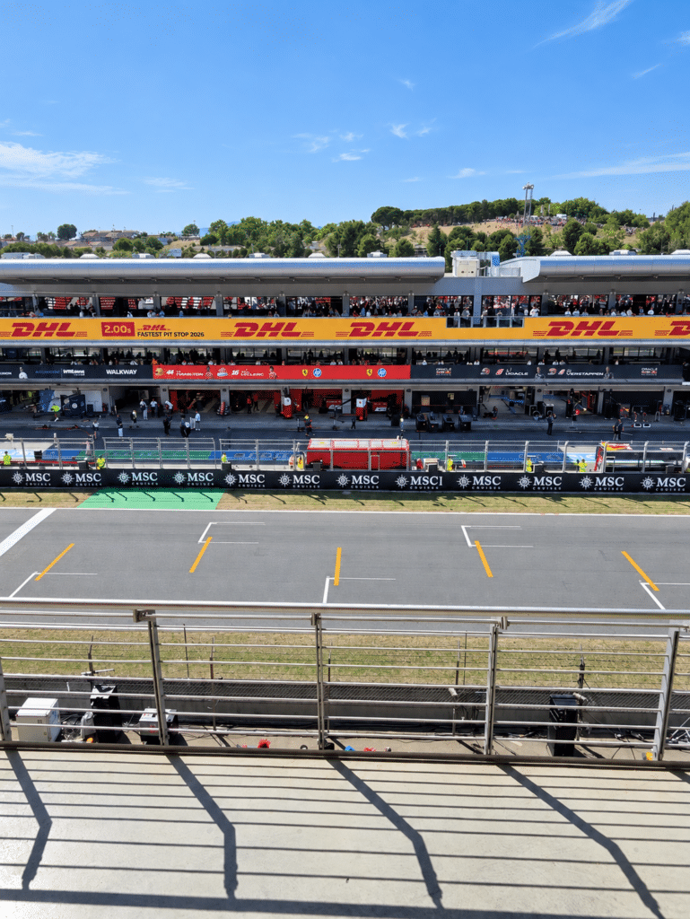 The Barcelona circuit’s main straight and pit building viewed from the grandstands.
