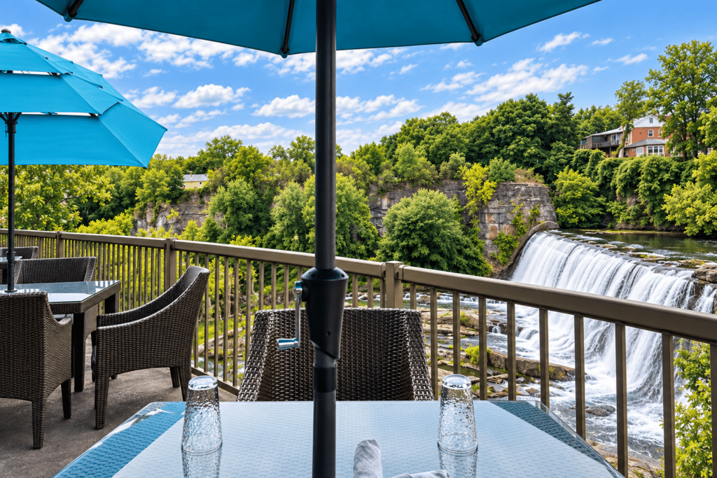 Outdoor dining terrace at BLACKBARN Hudson Valley overlooking Esopus Falls