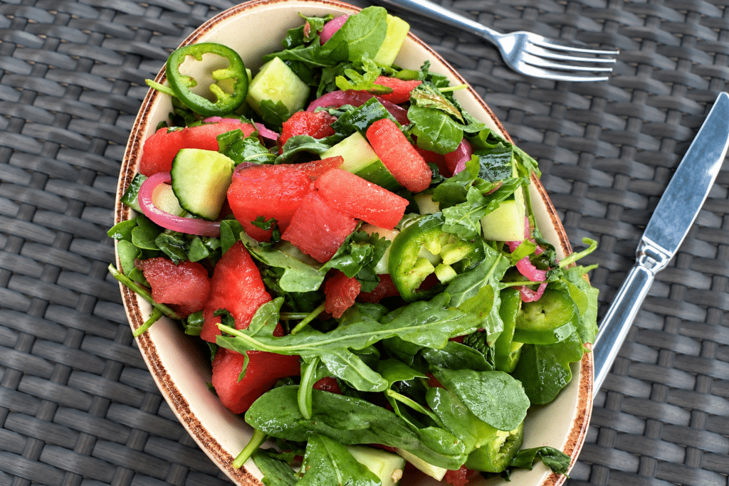 Spicy watermelon salad with greens and fresh vegetables at BLACKBARN Hudson Valley