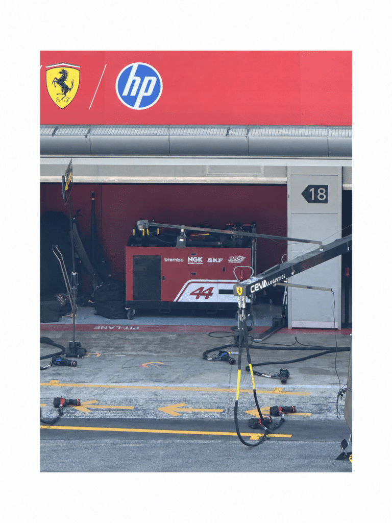 Ferrari garage and pit equipment beneath Lewis Hamilton’s name and number 44 in Barcelona.