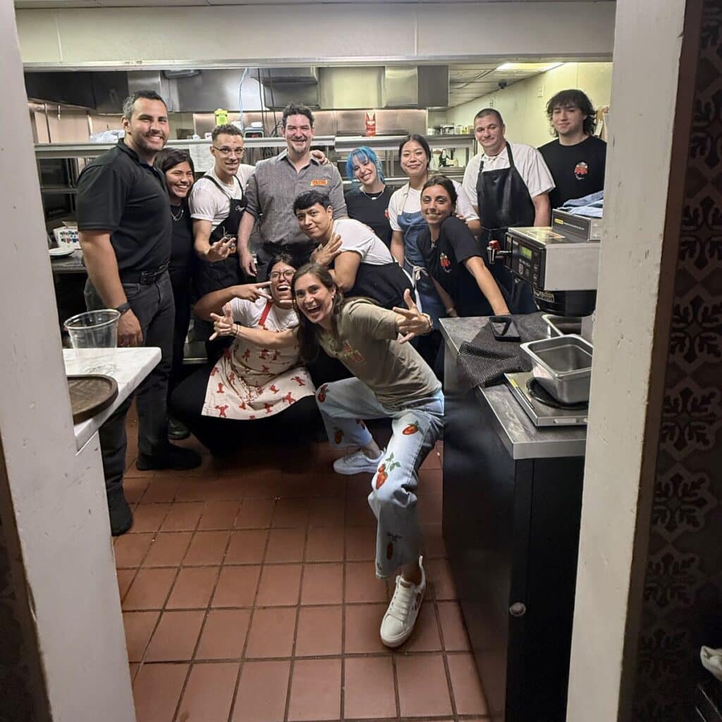 Chef Rabbit, Sam and Lisa from La Valle Foods posing with the team for a group photo in Viaggio’s kitchen.