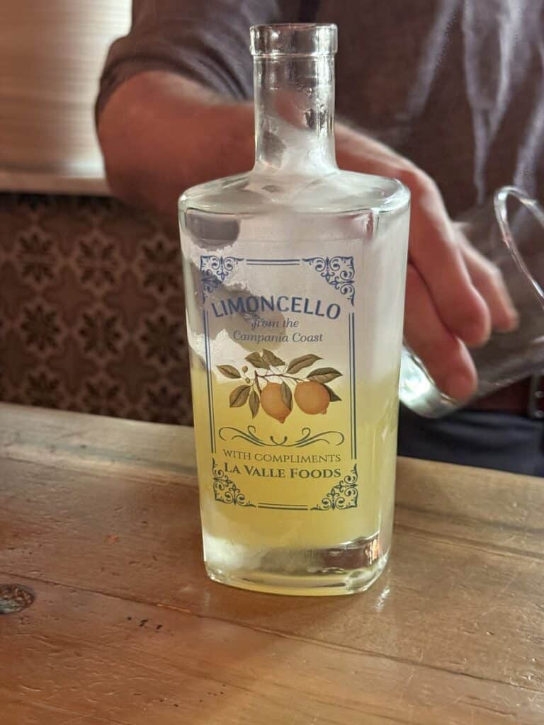 Frosted bottle of La Valle Foods limoncello on the wooden counter at Viaggio.
