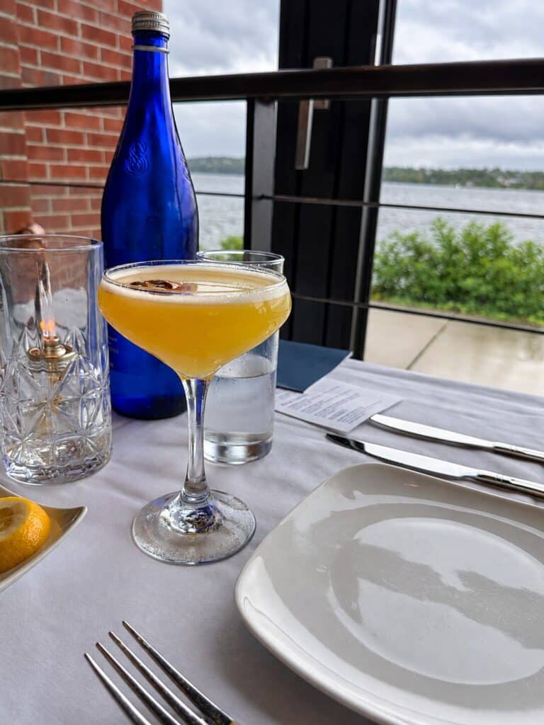 Blu Pointe Review Yellow cocktail served at Blu Pointe overlooking the Hudson River