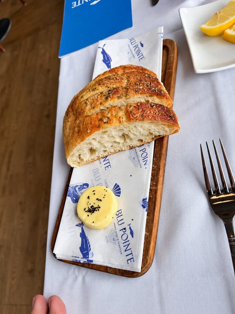 Sliced bread and butter served during dinner at Blu Pointe