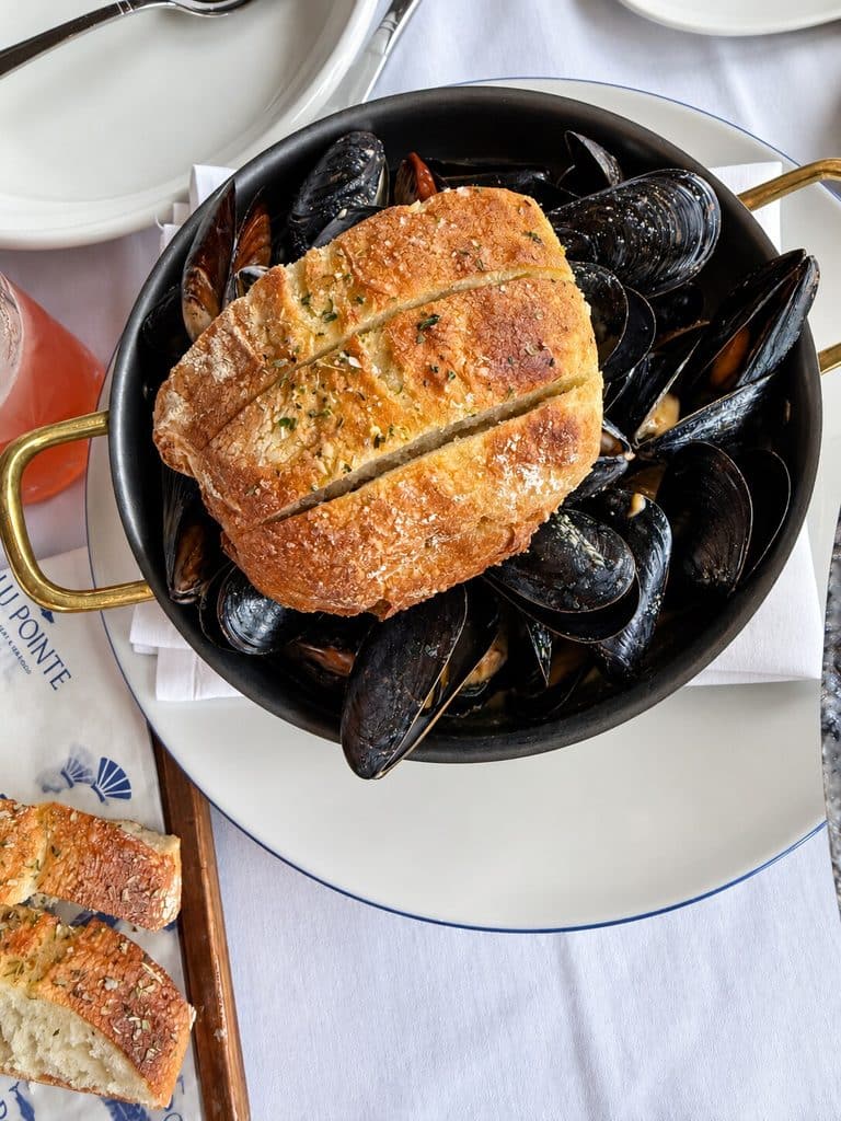 Mussels served in a pot with bread at Blu Pointe in Newburgh