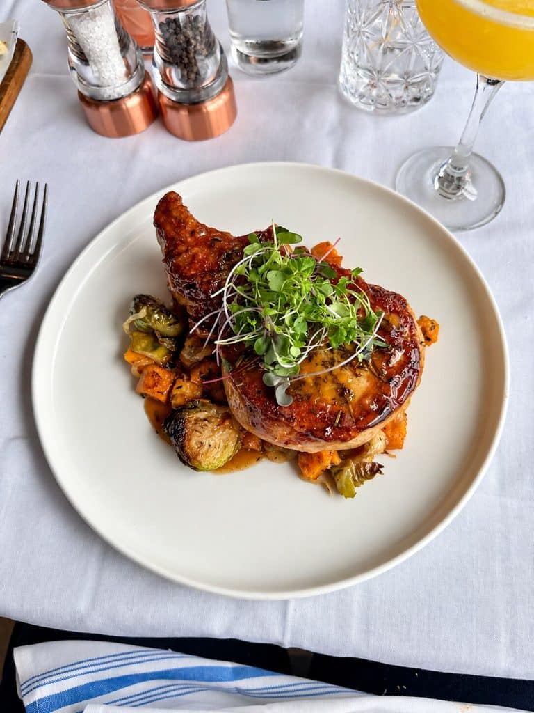 Berkshire Pork Chop with fingerling potatoes and vegetables at Blu Pointe