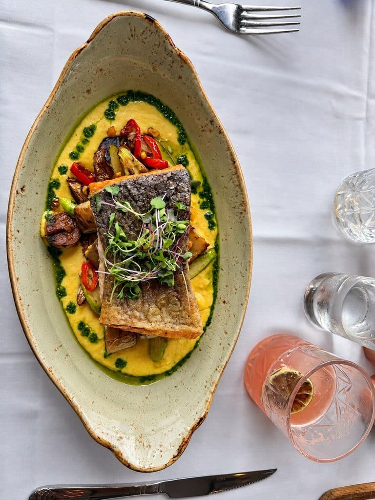 Hiddenfjord Salmon with summer succotash and basil chimichurri at Blu Pointe