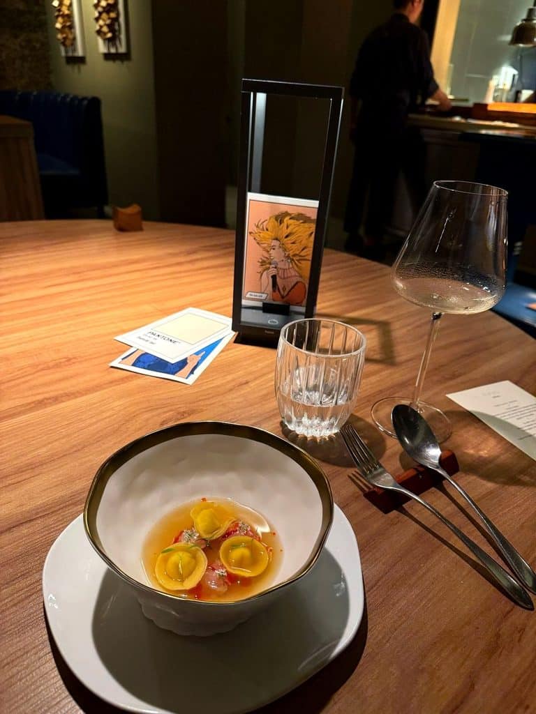 Formula 1 Luxury Travel Evvai tasting menu course with illustrated story card in São Paulo
